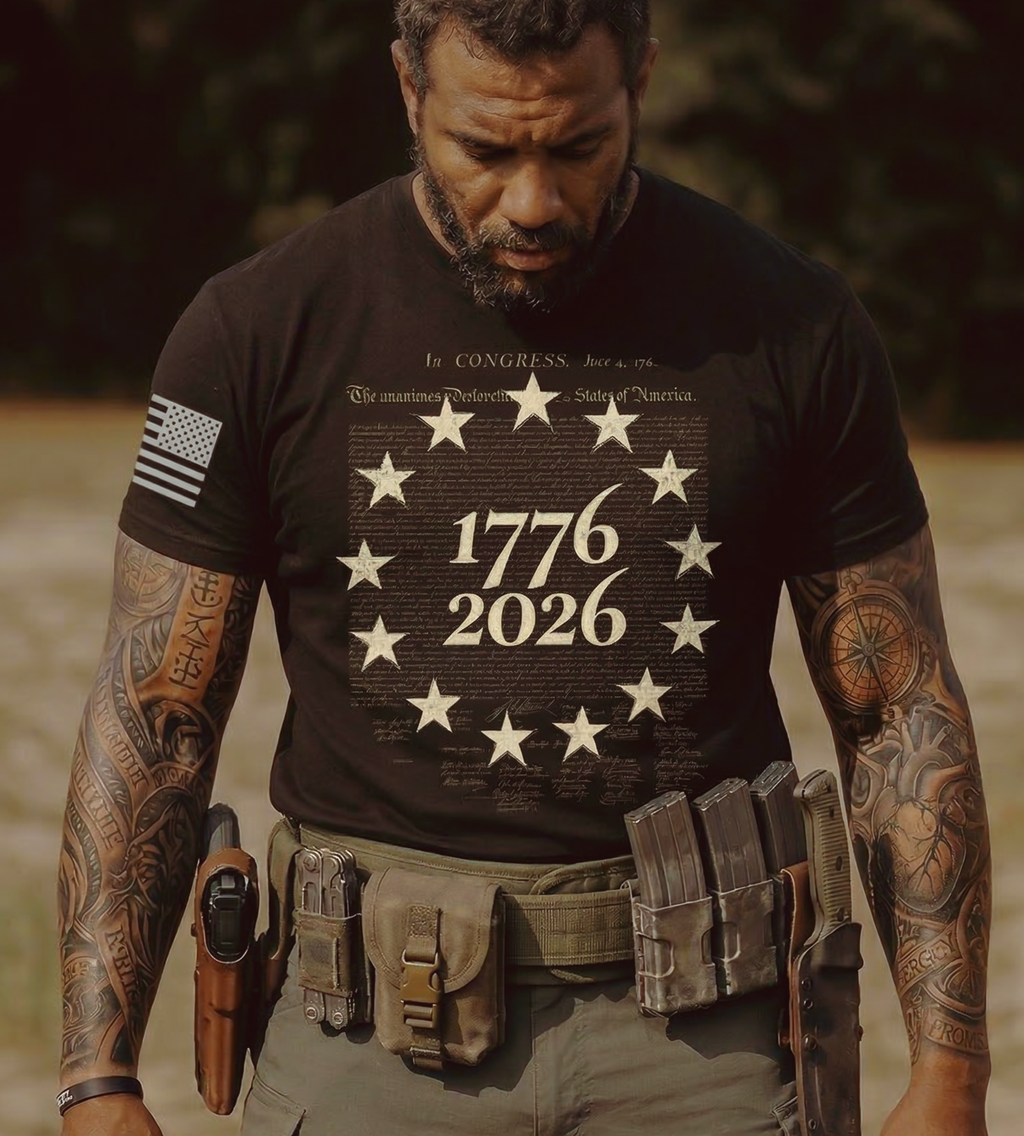 Man wearing black 1776 2026 patriotic t-shirt with Betsy Ross star circle and vintage Constitution script design
