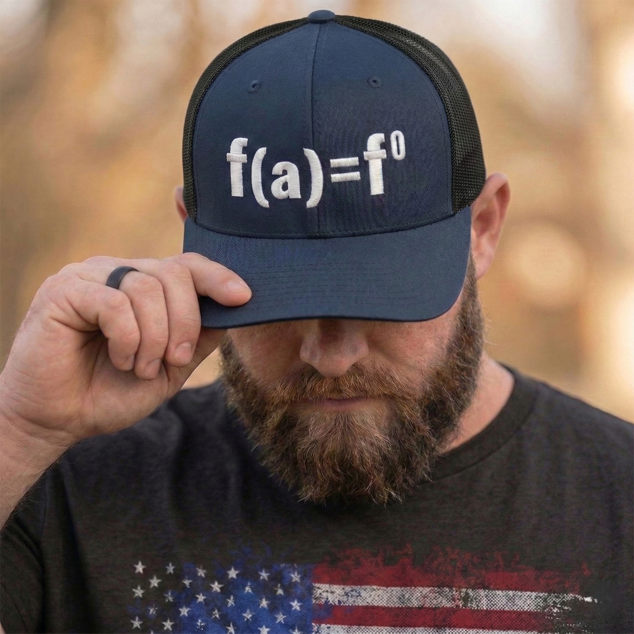 Navy blue patriotic trucker hat with FAFO bold embroidered design, structured six panel mesh back adjustable hat
