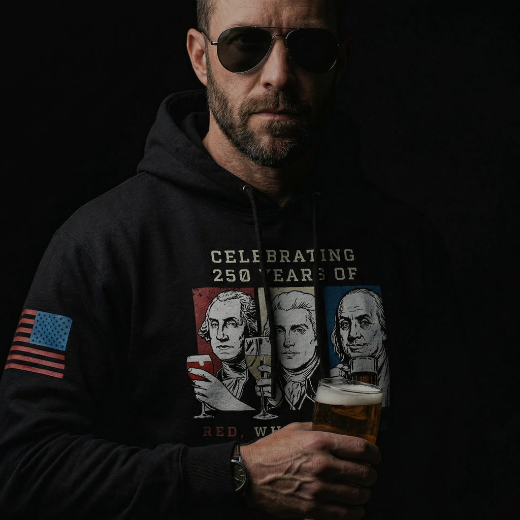 Man wearing a black Red White and Brew 250 years patriotic hoodie with founding fathers drinking graphic