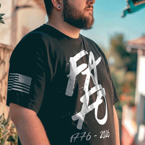 Man wearing black FAFO 1776 2026 patriotic t-shirt in outdoor street setting